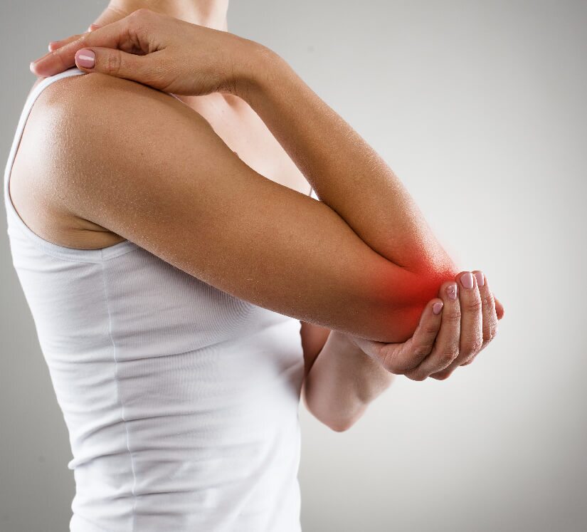 woman holding her elbow in pain